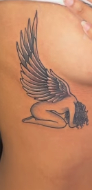 After: angel with wings cover-up tattoo
